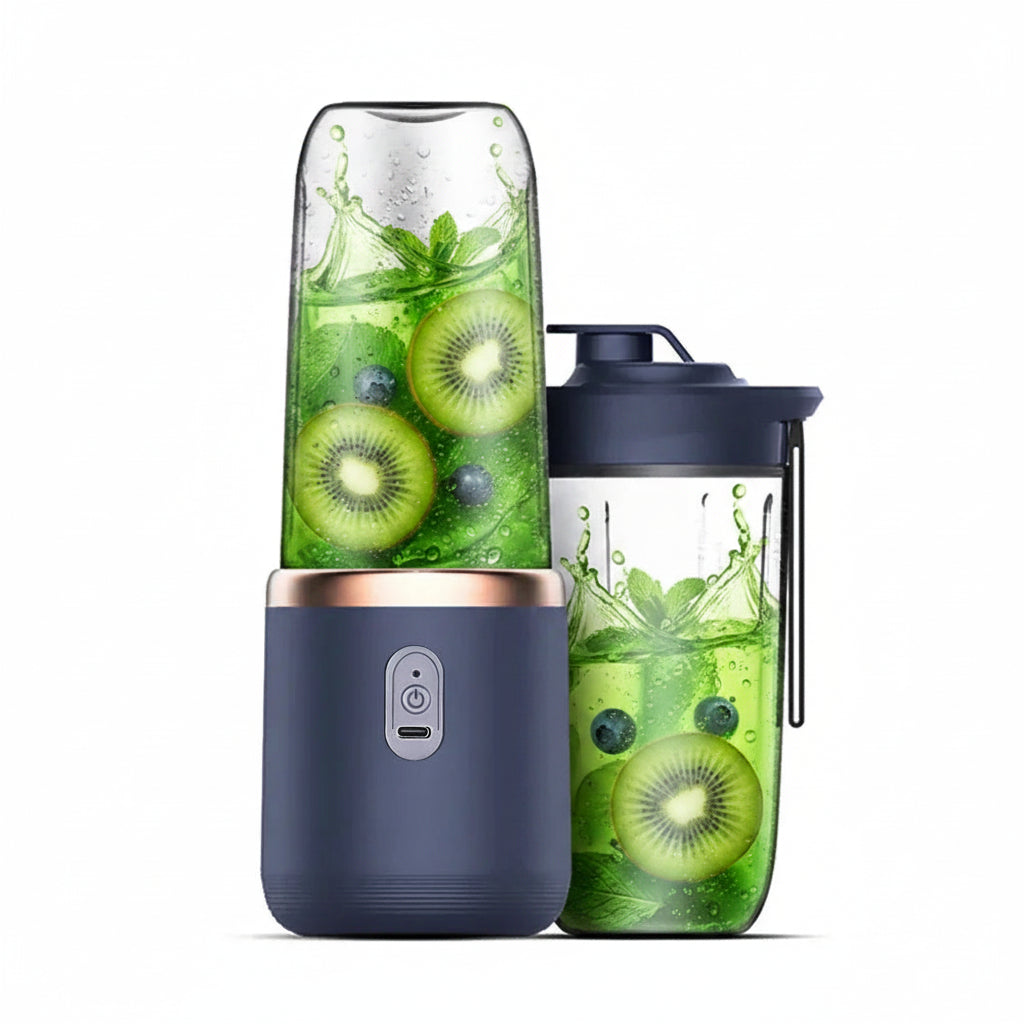 Navy blue portable blender with a clear container showing a red juice blend on a white background