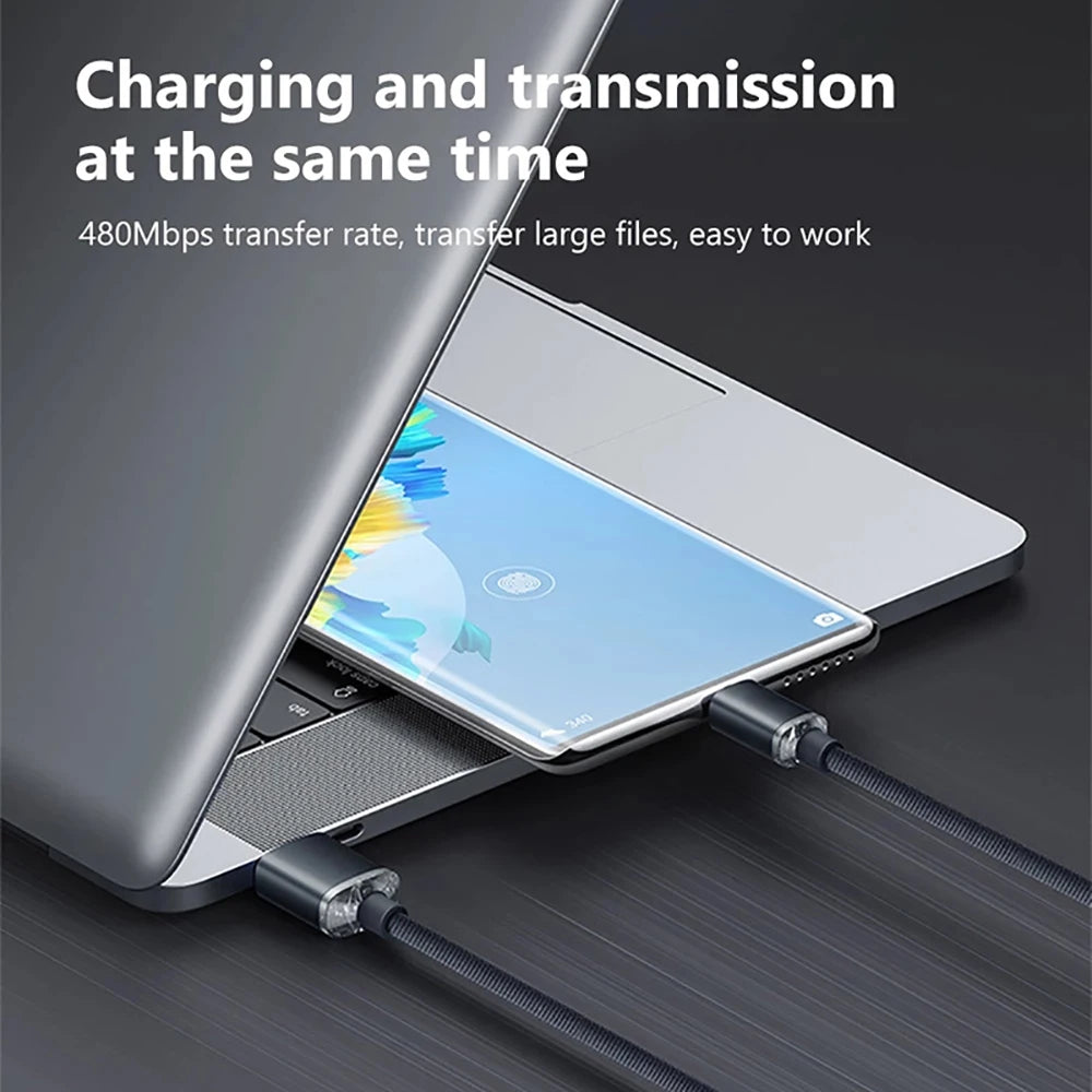Laptop with a smartphone attached via a cable, displaying text about charging and transmission capabilities.